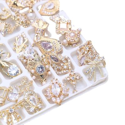 China 2022 Hot Sale Luxury Nails Art Zircon Gold Metal Nails Designers Charm Luxury Flexible Press On 3d Alloy Mixed Nail Art Accessories for sale