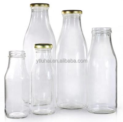 China 2021 recyclable wholesale round glass milk bottle jars 8oz 12oz 14oz 32oz glass bottle for milk with metal lid for sale