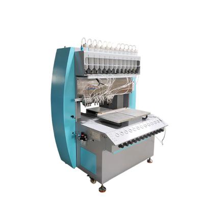 China Printing Stores Silicon Dispenser Machine For PVC Sports Logo Rubber Patch for sale