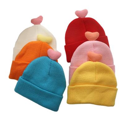 China COMMON Wholesale Candy Colors Warm Cotton Dobby Hat Unisex Style Roll Fashion Love Woolen Heart Knitted Winter Baby Hats for sale