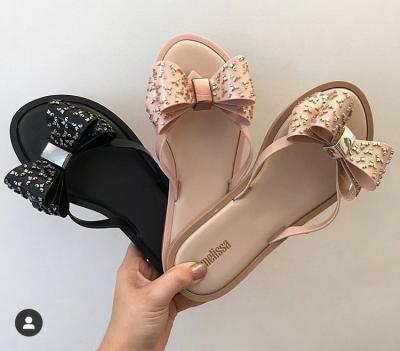 China Jelly Slippers Bow Women's Single Flip Flop Pink Fashion Trend Whole Jelly Sandal Sale Shoes Relieve PVC Flip Flop Online For Lady for sale