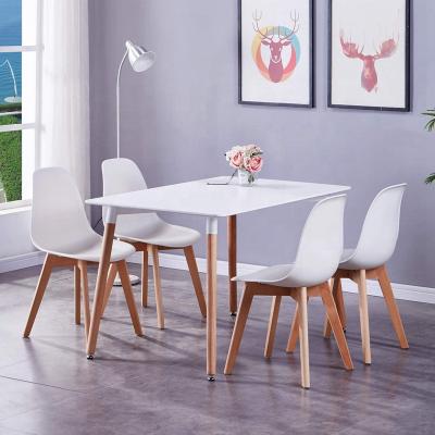 China MDF table tops and wooden legs 2022 hot sale high quality fancy black rectangle mdf dining table square modern wooden white legs dining tables for sale for sale