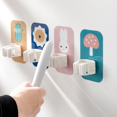 China Behind Doors/On Walls Household Kitchen Bathroom No-Punch Multifunctional Broom Holder Hot Selling New Creative Cartoon for sale