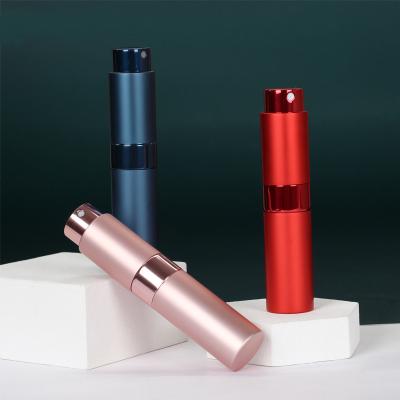 China Personal Care 10ml Refillable Twist Up Aluminum Perfume Atomizer For Travel for sale