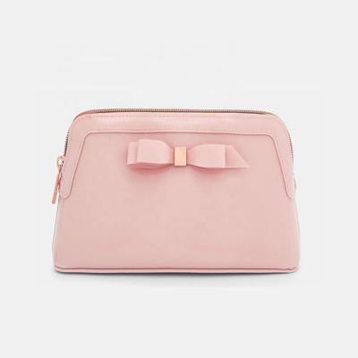 China Fashion Custom Personalized Small Travel PVC Bow Patent PU Leather Cosmetic Pouch Make Up Bag for sale