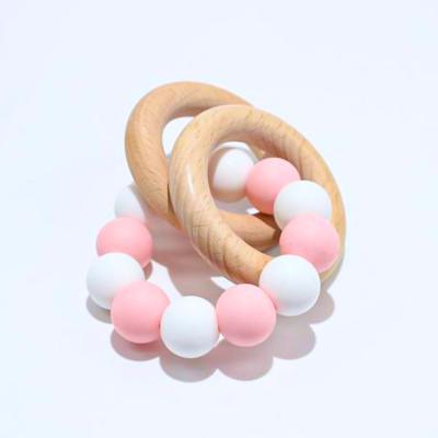 China Toy Custom Logo Beech Ring Soft Silicone Beads Teether Bracelet Baby Teething Toys Jingle for sale