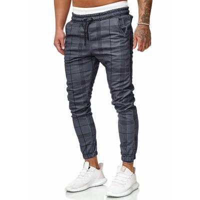 China Hot-selling Anti-wrinkle fashion Micro-elastic plaid pants, plus size cotton sweatpants, Mid-waist and lace-up casual pants small feet for sale