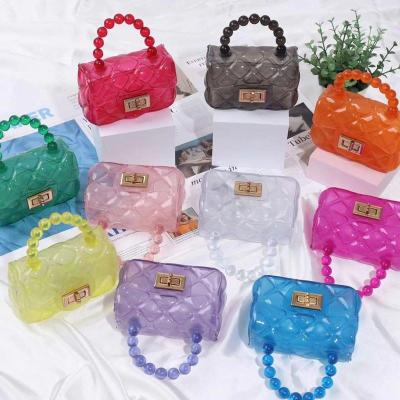 China Fashion candy colors transparent pearl handbag single shoulder little girls mini child jelly bag jelly purse women for sale