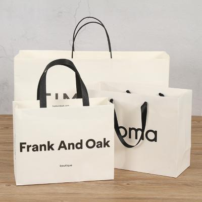 China Custom Printing Logo Bags White Shopping Bag Biodegradable High Selling Paper Tote Bag For Clothes for sale