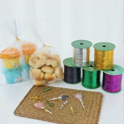 China Flower tie wire, food packaging tie roll, colorful gift sealing rope 300,400 yards gold and silver tie for sale