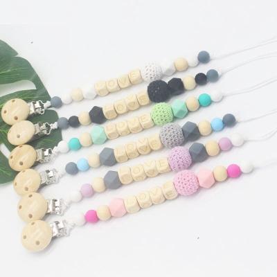 China Hot Sale Amazon BPA Wholesale Pacifier Chain Holder Clip Free Colorful Cute Baby Dummy Teether Pacifier Beads Clip for sale