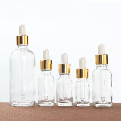 China Personal Care 30ml 50ml 100ml Clear Glass Bottle With Plastic Kid Resistant Dropper Cap Boston Around Glass Bottle Essential Oil Bottles for sale