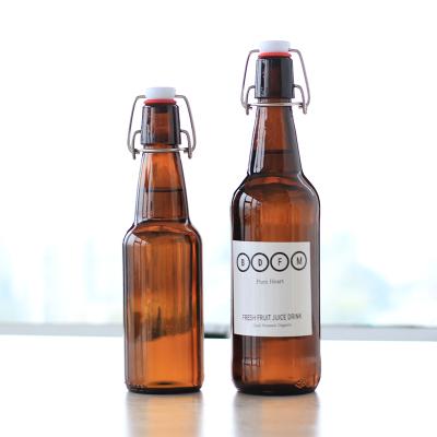 China Amber Glass Beer Bottle 330ml Beverage Bottle 500ml Kombucha Glass Beer Bottle With Swing Top for sale