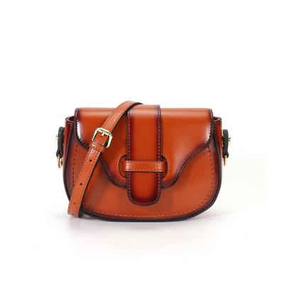 China 2023 new fashion trend leather armpit round lady bags real small saddle bag shoulder messenger bag for sale