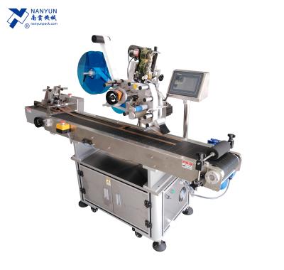 China 2020 hot sale CLOTHING NY-817F flat surface side bag top labeling machine for baby diaper/sugar/nut/mushroom for sale