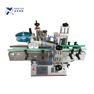 China NY-822E Manual Semi Automatic Food Factory Sticker Label Equipment Machine For Plastic Glass Bottles for sale