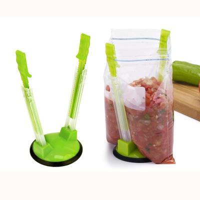 China Sustainable Rack Adjustable Plastic Food Storage Bags Loose Clip Holder Stand Holder for sale