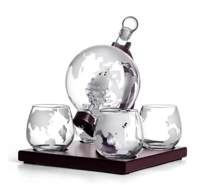 China New Classic/Postmodern Hot Selling Handmade 850ML Whiskey Decanter Glass Globe Shape Set Inner With Boat Design With Wooden Base With 4 Globe Cups for sale