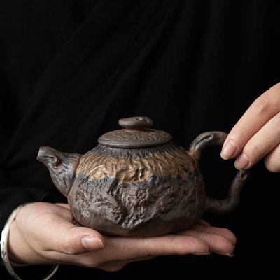 China Viable Japanese Golden Zen Kettle Luster Iron Handle Pot Coarse Handmade Pottery Teapot Small Size Tea Making Device for sale