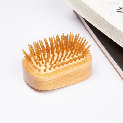 China For home use customized logo portable natural wood stiffens airbag comb massage hair pocket comb for sale