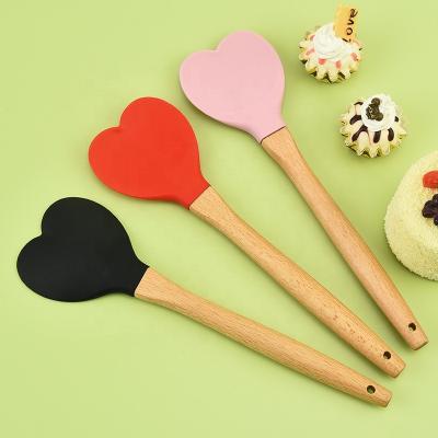 China Creative Heart Shaped Silicone Handle Stain Viable Scraper Wooden Kitchen Tableware Cooking Tools for sale