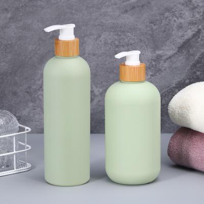 China 400ml 500ml Soft Touch Cosmetic Squeeze Bottle With Bamboo Lid For Shampoo Body Butter Lotion for sale