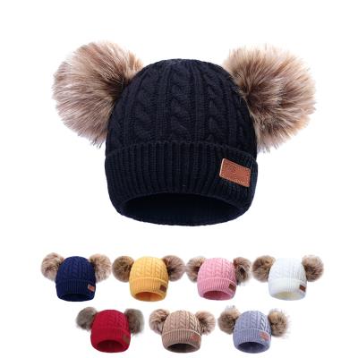 China COMMON Warm Wholesale Custom Made Double Pom Pom Baby Toddler Children Winter Private Label Knitted Beanie Hats With Fur Pompom for sale