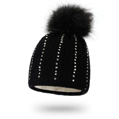 China Women's COMMON beanie buckle hat winter warm fashion knitted winter thick wool ball caps diamonds small beanie hat wholesale for sale