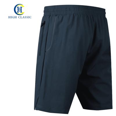 China Anti-wrinkle summer quick-drying polyester sports men's shorts with drawstring for sale