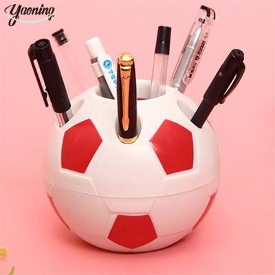 China Pen Stand the new model desk stationery Promotional Factory price LOW MOQ beautiful Multi color plastic 3d football shaped pen holder for sale