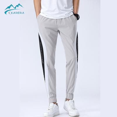 China New Men's Breathable Patchwork Casual Light Weight Streetwear Outdoor Running Trousers Athletics Pants for sale