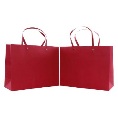 China Recyclable Stain Red Color Matt Laminated Art Paper Bag Brand Shopping Package Christmas Gift UV Printing Paper Bag for sale