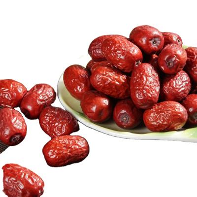 China 100% Organic Ruoqiang Dried Sweet Red Dates Wholesale Bulk Dried Food Snack Jujube Improve Anemia and Beauty Long Oval for sale