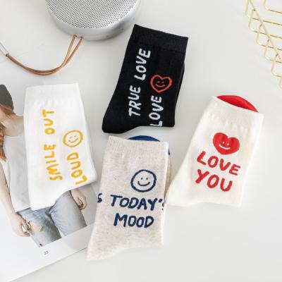 China 2021 Autumn English Letter Women Crew Socks Breathable Smile Face White Long Sock For Couples for sale