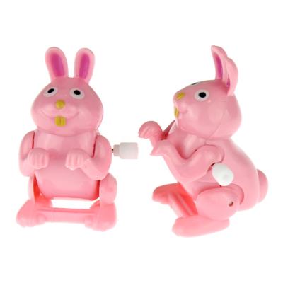 China Low Price Plastic Pink Cogs Wind Up Toys Easter Party Supplies Bunny Decorations Jumping Bunnies For Kids for sale