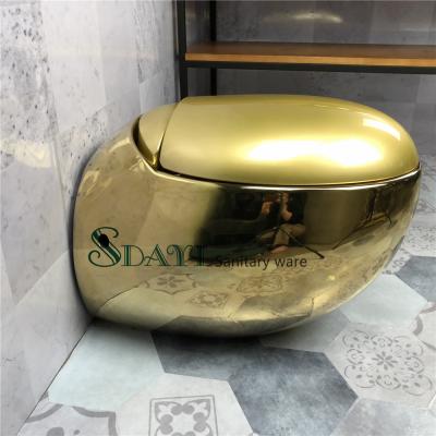 China European Hot Selling Hidden Tank SDAYI Egg Shape Round Wall Hung Toilet Gold Color Ceramic Wall Hung Toilet for sale