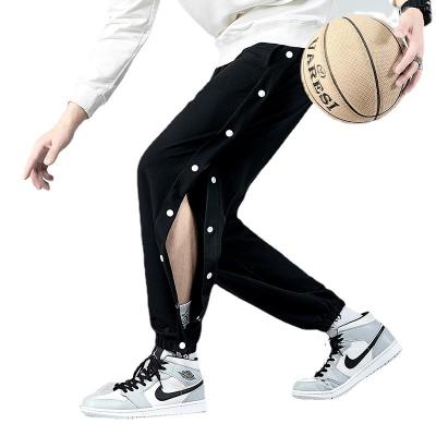 China Anti-wrinkle sports breasted pants mens side wide open button loose leggings training guard pants basketball pants for sale