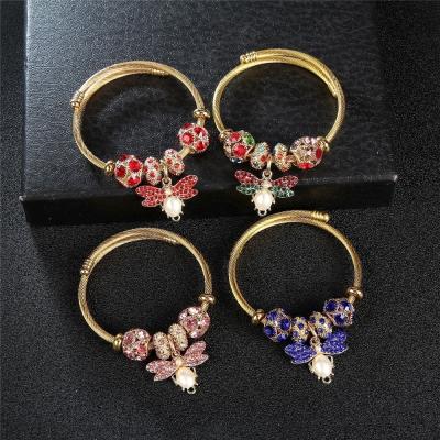 China Casual/Sporty Bead with Diamond Bee Butterfly Charms Gold Color Stainless Steel Expandable Bracelets and Bangles for sale