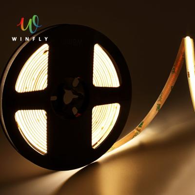 China Indoor LED strip light silicone cob led strip lights IP62 12V dotless linear free ultra thin led strip factory price no dots for sale