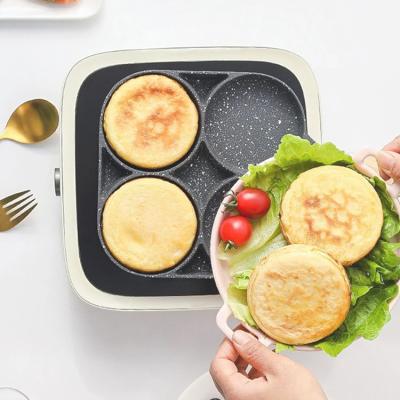 China Sustainable Four-Hole Multi-Purpose Egg Omelet Pan Non-Stick Flat Bottom Frying Pan for sale