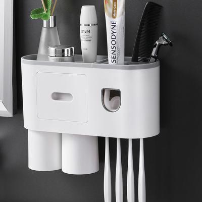 China Sustainable Automatic Toothpaste Squeezer Dispenser Bathroom Wall Mount Toothbrush Holder Storage Rack for sale