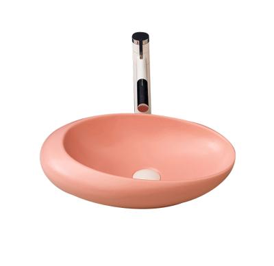 China Modern Modern Pink Oval Shape Ceramic Wash Basin Bathroom Art Sink 2021 Design for sale