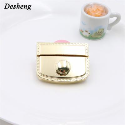 China Lock For Handbags/High Quality Metal Push Button Genuine Leather Smooth Shiny Locks Bag Parts/Purse Bag For Woman Bag for sale