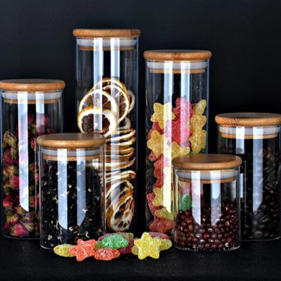 China CANDY Food Storage Canister Airtight Round Bamboo Lid Glass Jar Pasta Glass Container With Wooden Lid for sale