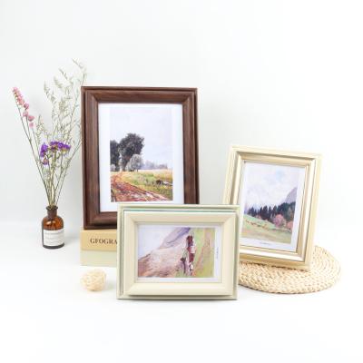 China Wholesale Plastic American Retro Style Wall Arts Picture Picture Frames For Room Decoration Wooden Custom 3 Color for sale