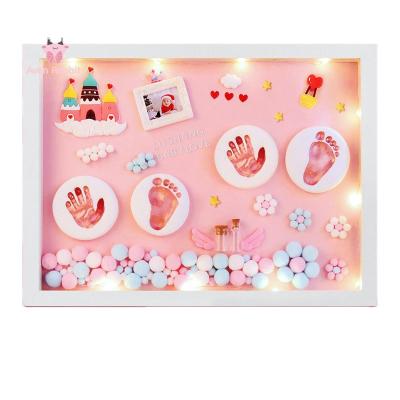 China Custom Wooden Baby Handprint Newborned MDF Baby Foot Print Mold 3d Footprint and Footprint Photo Picture Frame Kit Wholesale for sale