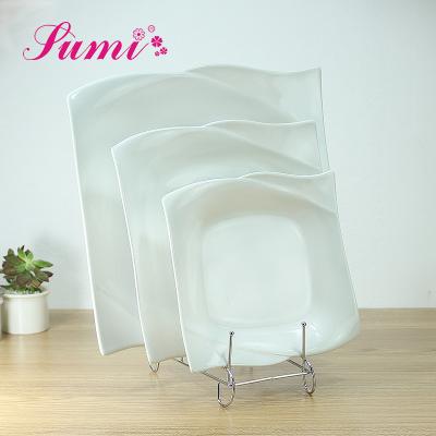 China Sustainable Chinese Wholesale White Wavy Shape Square Dinner Plate for sale