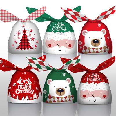 China 50pcs Fashion Christmas Product Pattern Candy Bag Gift Plastic Bag With Bunny Rabbit Ears Ties For Christmas Xmas Holiday Party Supplies for sale