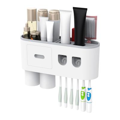 China Sustainable Multifunction Wall Mounted Automatic Toothbrush Holder With Toothpaste Dispenser for sale