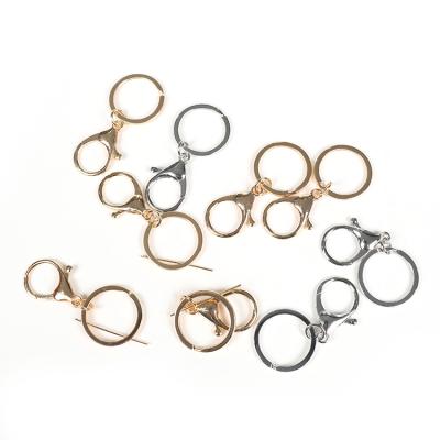 China Natural Wholesale Cheap Silver Bag Accessories Gold Key Chains Sell Well for sale